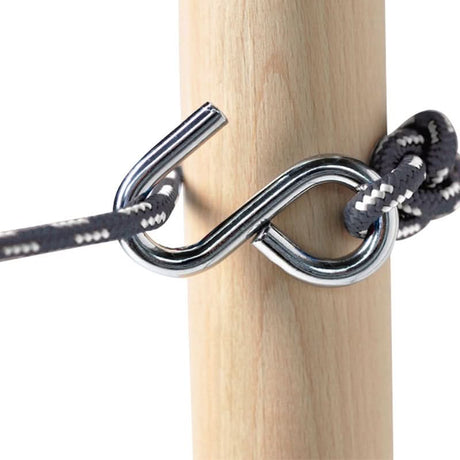 Metal S-hook with rope tied to a wooden post on a white background
